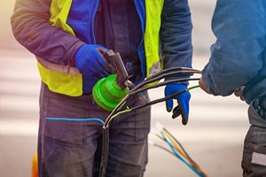 Person using heat gun to shrink tubing