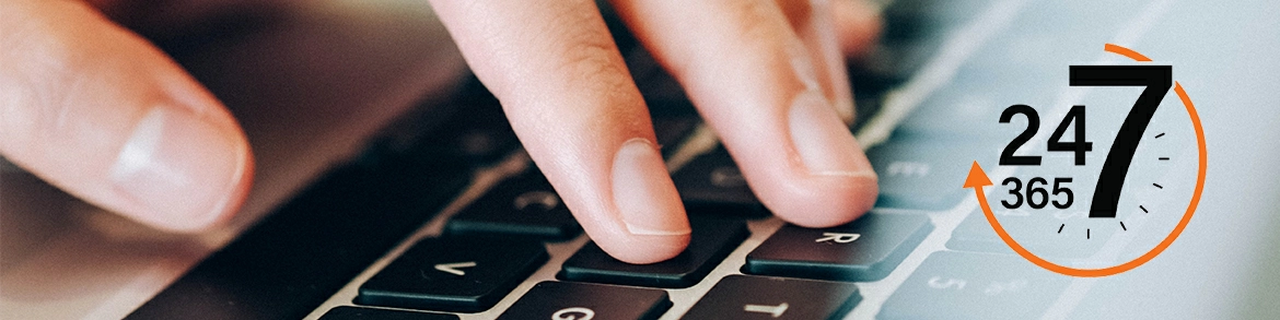 Fingers on a keyboard with a 24/7/365 logo in the corner